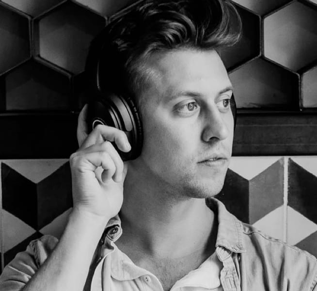 A man wearing the XX99 mark 2 headphones.